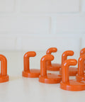 Vintage Orange Plastic Coat Hook: Mid Century Modern Wall Decor (NOS)